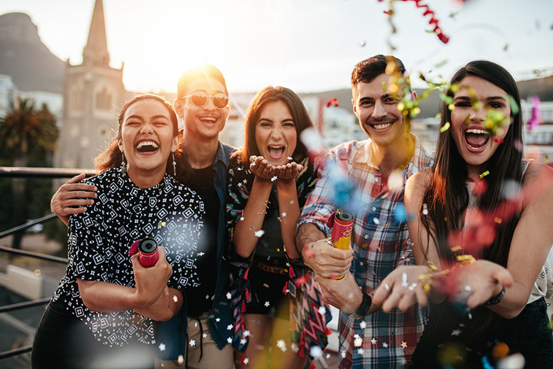 Friends with white teeth at party