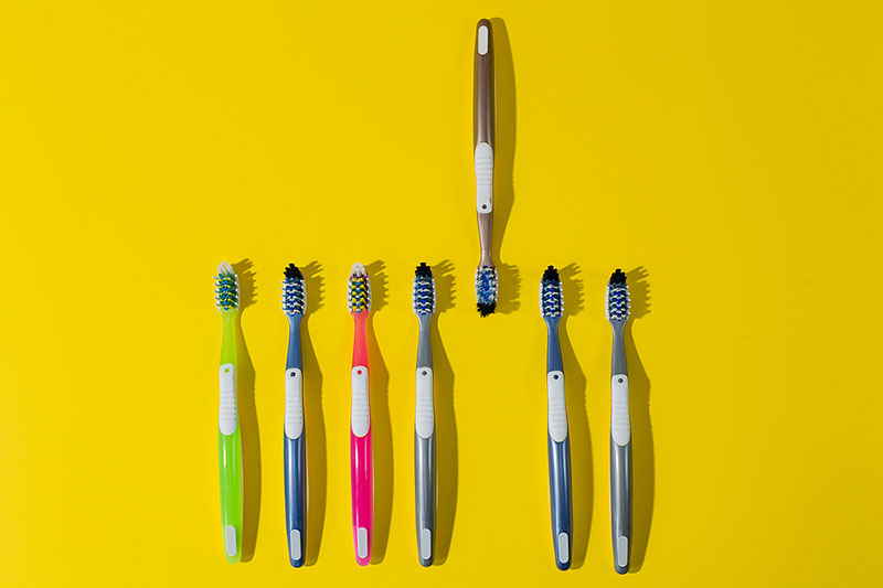 Seven plastic toothbrushes